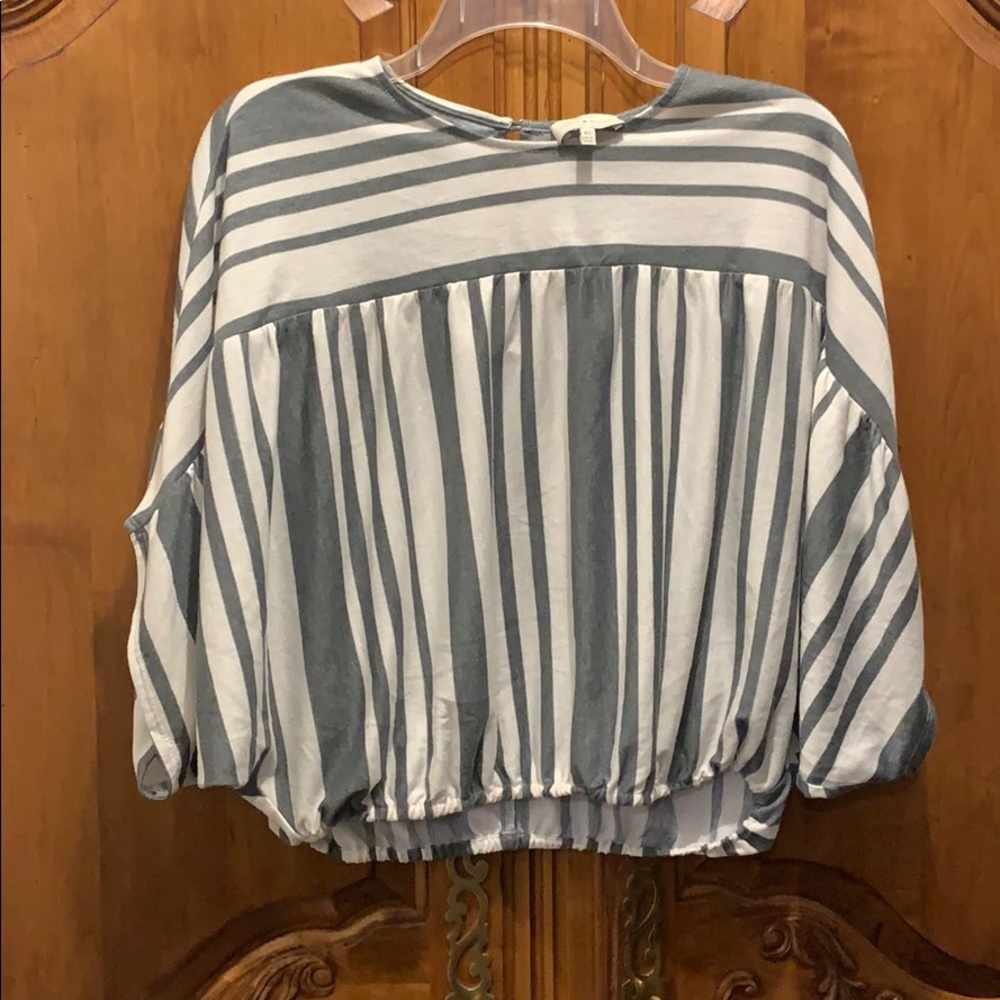 Light blue and white stripped shirt. (xs)